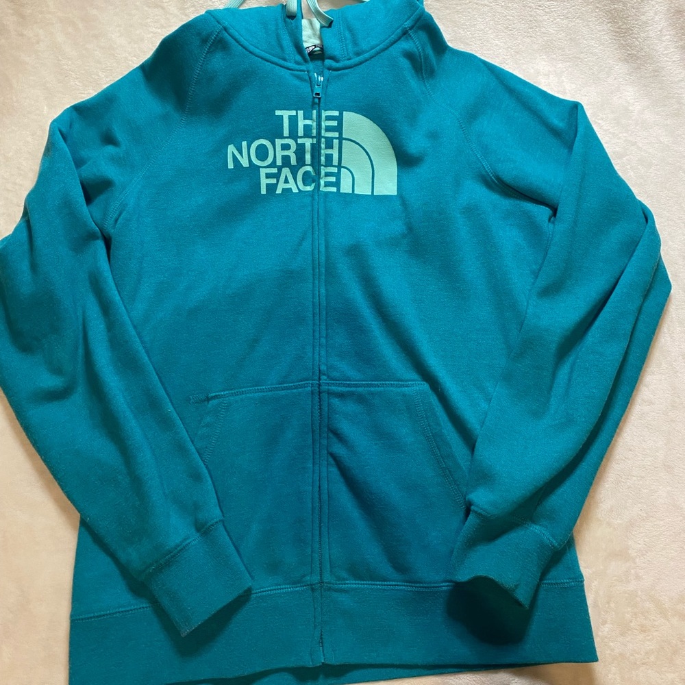 Large North Face zip up jacket.